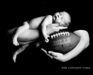 newborn baby with football
